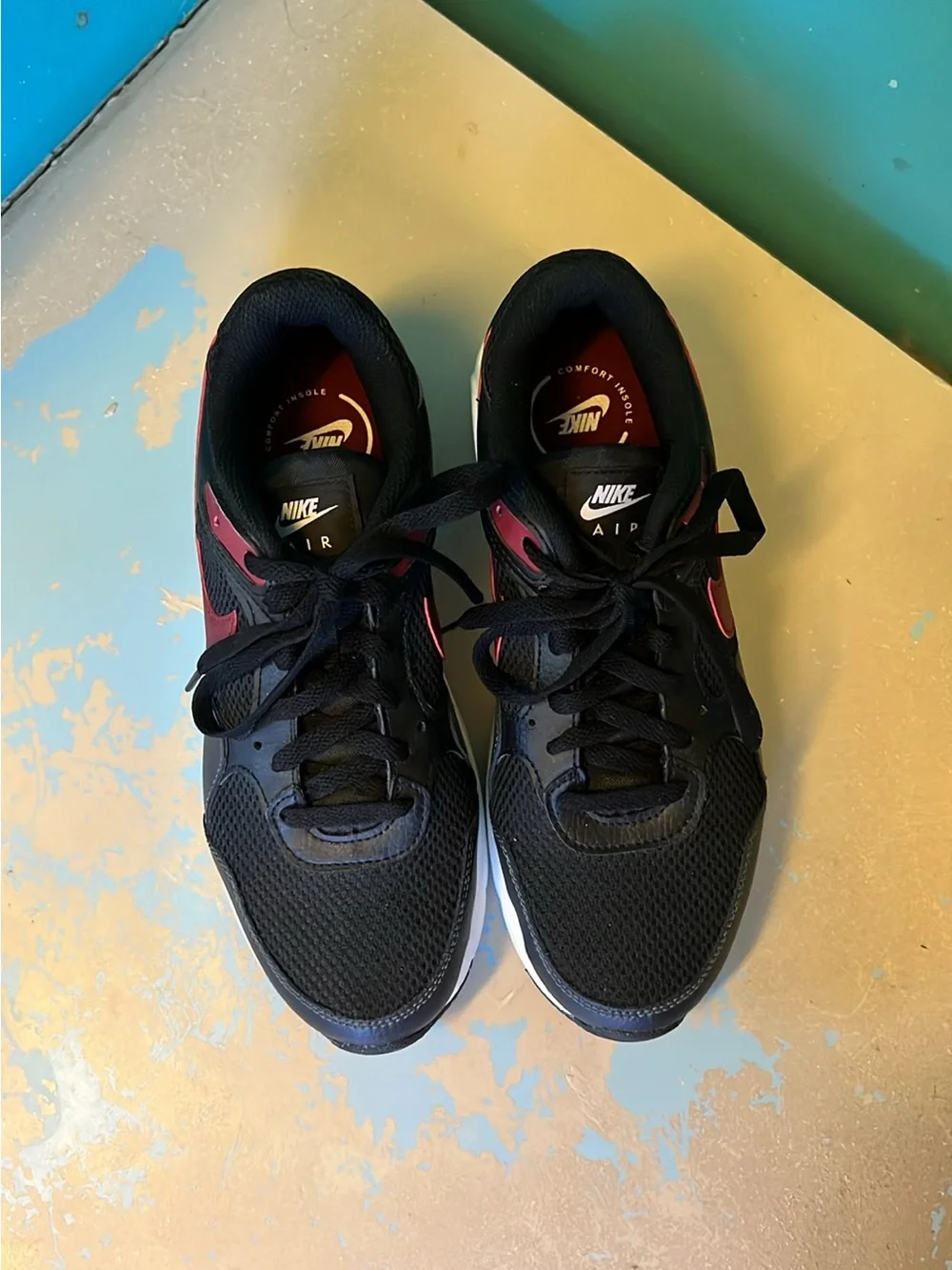 Nike Black Sneakers with Burgundy Swoosh and White Midsole